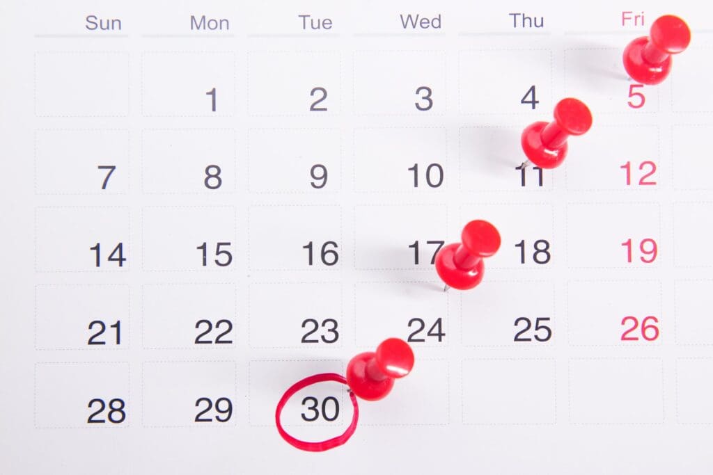 commercial property tax deadline reminder calendar with red push pins and date circled