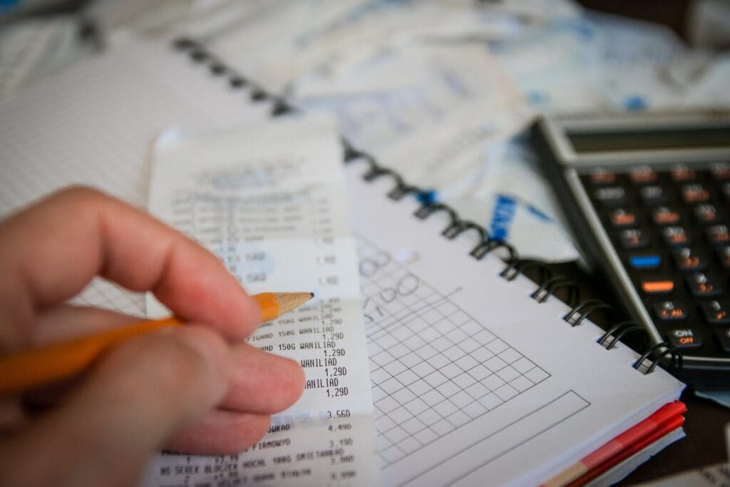 Man with pencil, calculator and business personal property tax calculations