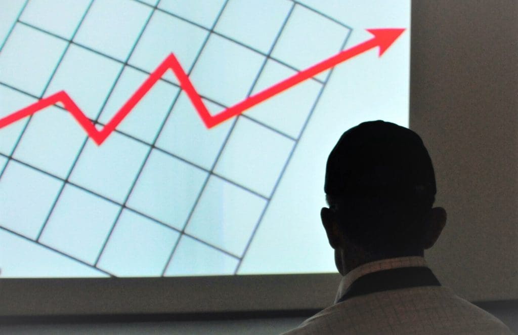 Man and graph indicating high commercial property values over time