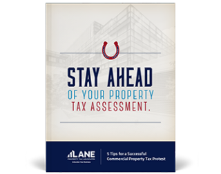Horseshoe, commercial building and text "top five tips to a successful property tax protest"